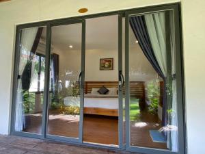 Ένα ή περισσότερα κρεβάτια σε δωμάτιο στο The Legend Coco Beach