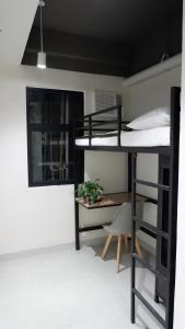 Un pat suprapus sau paturi suprapuse la The Grid Co-Living Managed by HII