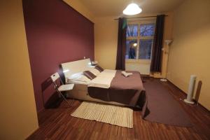 a bedroom with a large bed and a window at 2 Bedrooms close Vyšehrad - Congress centrum in Prague