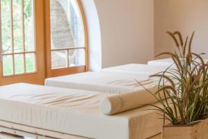 Letto o letti in una camera di Hotel Weihrerhof