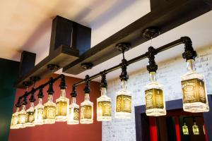a row of glass lights hanging from a ceiling at Arch Inn in Hualien City