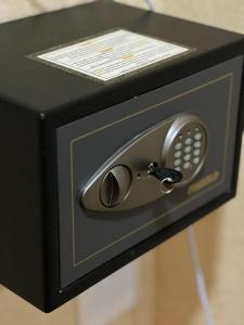 a black box with a safe with a phone at Hayot Hostel in Tashkent