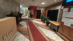 a lobby with a red carpet in a building at شقة انور المفتى للعائلات فقط 113 in Cairo