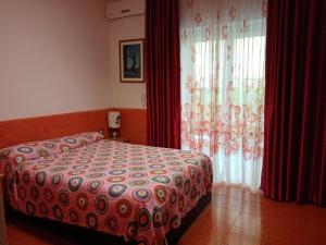 A bed or beds in a room at Villa Betta