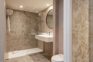 a bathroom with a toilet and a sink at Dukes' Academie Brugge - by Dukes' Hotel Collection in Bruges