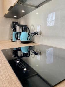 Cuisine ou kitchenette dans l'établissement Appartement spacieux à Pontaillac, proche plage