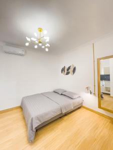 Posteľ alebo postele v izbe v ubytovaní OsOs Paviliun