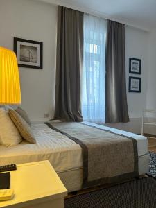 A bed or beds in a room at Just Studios