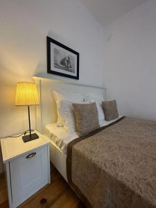 A bed or beds in a room at Just Studios