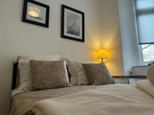 A bed or beds in a room at Just Studios