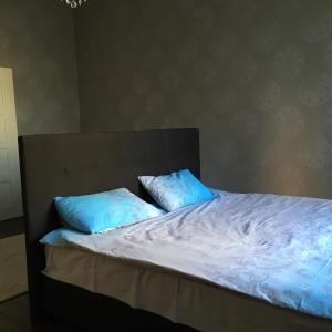 A bed or beds in a room at Mukachevo Centre Apartment