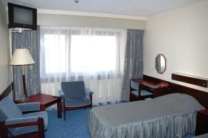 Postel nebo postele na pokoji v ubytování Hotel Druzhba