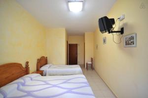 Postel nebo postele na pokoji v ubytování Pensio l'Avi Pep
