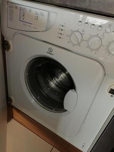 a washing machine is sitting on a counter at Studio Steinbocks Chill in Kaprun +19 photos