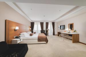 Una cama o camas en una habitación de Hotel Aurel
