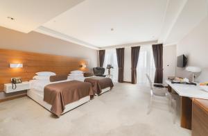 Una cama o camas en una habitación de Hotel Aurel