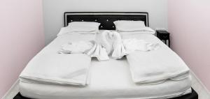 Posteľ alebo postele v izbe v ubytovaní Corso Lux Apartman