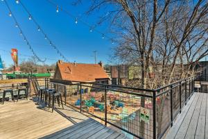 a bird cage on a deck with a house at Pet-Friendly Wichita Home with Deck, Near Dtwn in Wichita