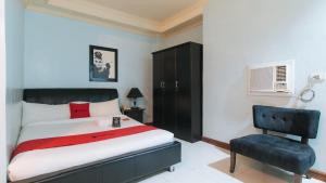 מיטה או מיטות בחדר ב-Holiday Plaza Hotel Tuguegarao City
