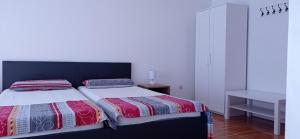 Postel nebo postele na pokoji v ubytování Apartmani Barišić