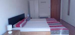 Postel nebo postele na pokoji v ubytování Apartmani Barišić