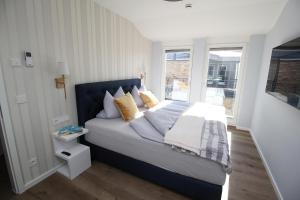 Postel nebo postele na pokoji v ubytování Villa Am Meer Glowe Apartment OG