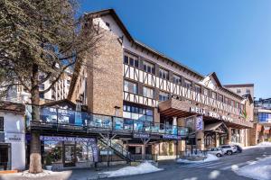 a building with a balcony on the side of a street at Melia Sierra Nevada in Sierra Nevada