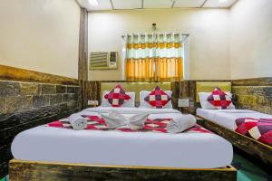 Terminus Hotel Bandra tesisinde bir odada yatak veya yataklar