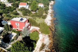 an aerial view of a house next to the water at Villa Karmen Adriatica in Kukljica