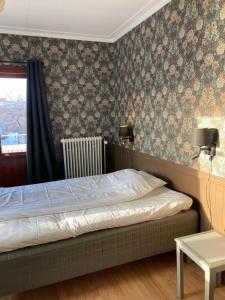 Postel nebo postele na pokoji v ubytování Hotell Stensborg
