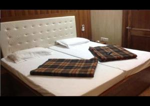 En eller flere senge i et værelse på Zeal Guesthouse By WB Inn