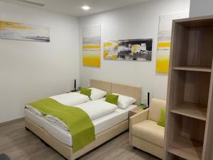 Postel nebo postele na pokoji v ubytování Hotel Garni Ilys Inn