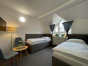 A bed or beds in a room at Hotel COLCHI