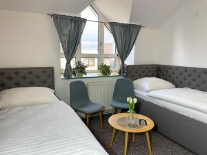 Postel nebo postele na pokoji v ubytování Hotel COLCHI