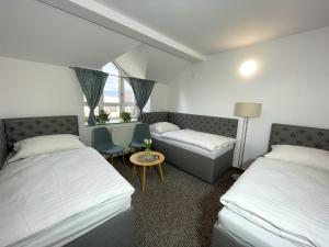 A bed or beds in a room at Hotel COLCHI