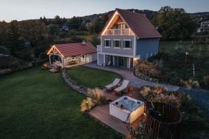 an aerial view of a house with a hot tub at Lovassy Lodge Vendégház in Lovas