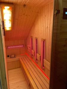 a small sauna with a tub in the middle at Zacisze Pod Reglami in Zakopane