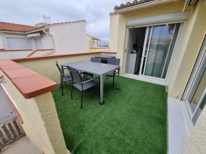 Balkón alebo terasa v ubytovaní Amour à la plage, appartement climatisé, terrasse à Barcares à deux pas de la plage