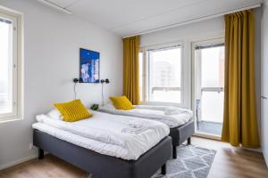 Postel nebo postele na pokoji v ubytování Hiisi Homes Espoo Finnoo