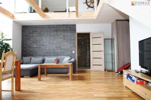 a living room with a couch and a table at Veski Villa in Pärnu