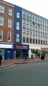 a building with a bike parked in front of it at House of Fisher - City Wall House in Reading