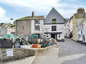 a street in a town with a building at Knights Den in Port Isaac