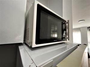 Kuchnia lub aneks kuchenny w obiekcie VER7 - ESTUDIO, Wifi, Fire Stick Amazon, Terraza, Vistas al mar, Piscina