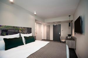 Ein Bett oder Betten in einem Zimmer der Unterkunft Leonardo Hotel Vienna City West