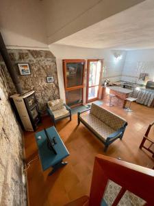 a living room with a couch and a fireplace at Antica Peschiera Porto Botte in Porto Botte