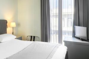 Postel nebo postele na pokoji v ubytování Le Palace Hotel