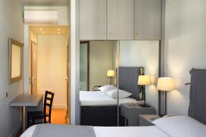 Postel nebo postele na pokoji v ubytování Le Palace Hotel