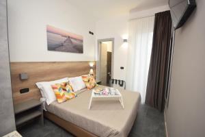 Postel nebo postele na pokoji v ubytování Hotel Crisvan