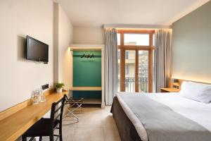 Postel nebo postele na pokoji v ubytování Le Palace Hotel