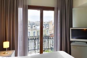 Postel nebo postele na pokoji v ubytování Le Palace Hotel